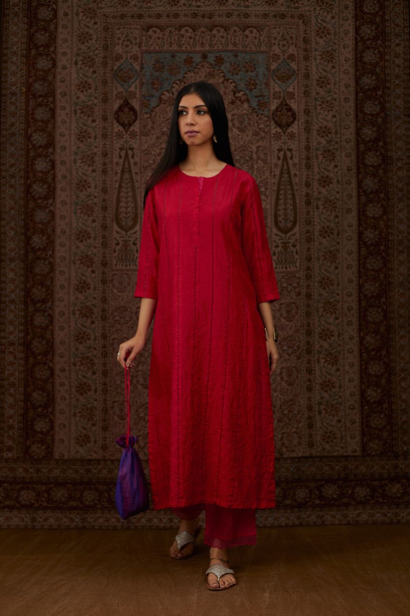 Red hand crushed silk straight kurta set with vertical organza fabric inset stripe detail in front, back and 3/4 sleeves, highlighted with contrasting top stitch.