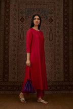 Red hand crushed silk straight kurta set with vertical organza fabric inset stripe detail in front, back and 3/4 sleeves, highlighted with contrasting top stitch.