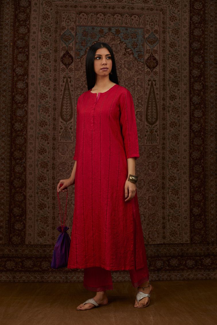 Red hand crushed silk straight kurta set with vertical organza fabric inset stripe detail in front, back and 3/4 sleeves, highlighted with contrasting top stitch.