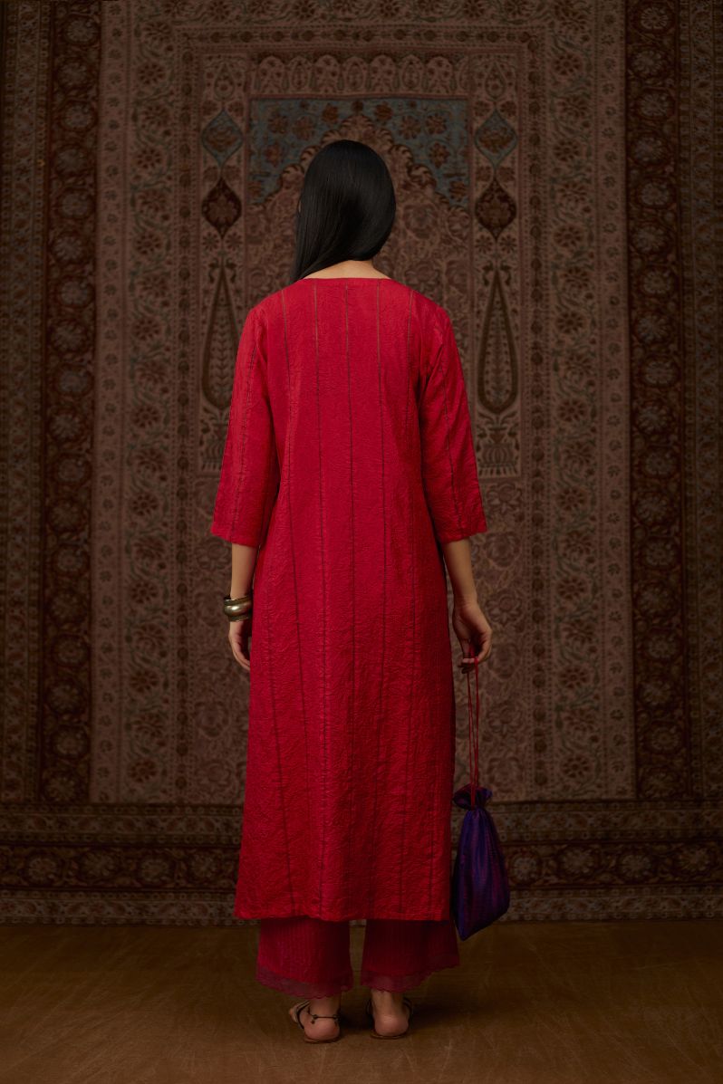 Red hand crushed silk straight kurta set with vertical organza fabric inset stripe detail in front, back and 3/4 sleeves, highlighted with contrasting top stitch.