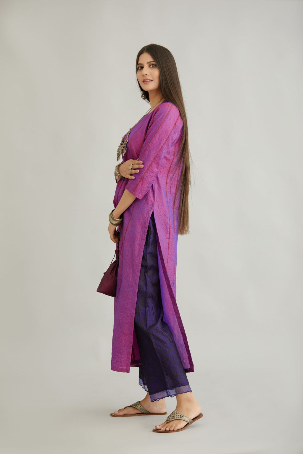 Purple hand crushed silk straight kurta set with vertical organza fabric inset stripe detail in front, back and 3/4 sleeves, highlighted with contrasting top stitch.