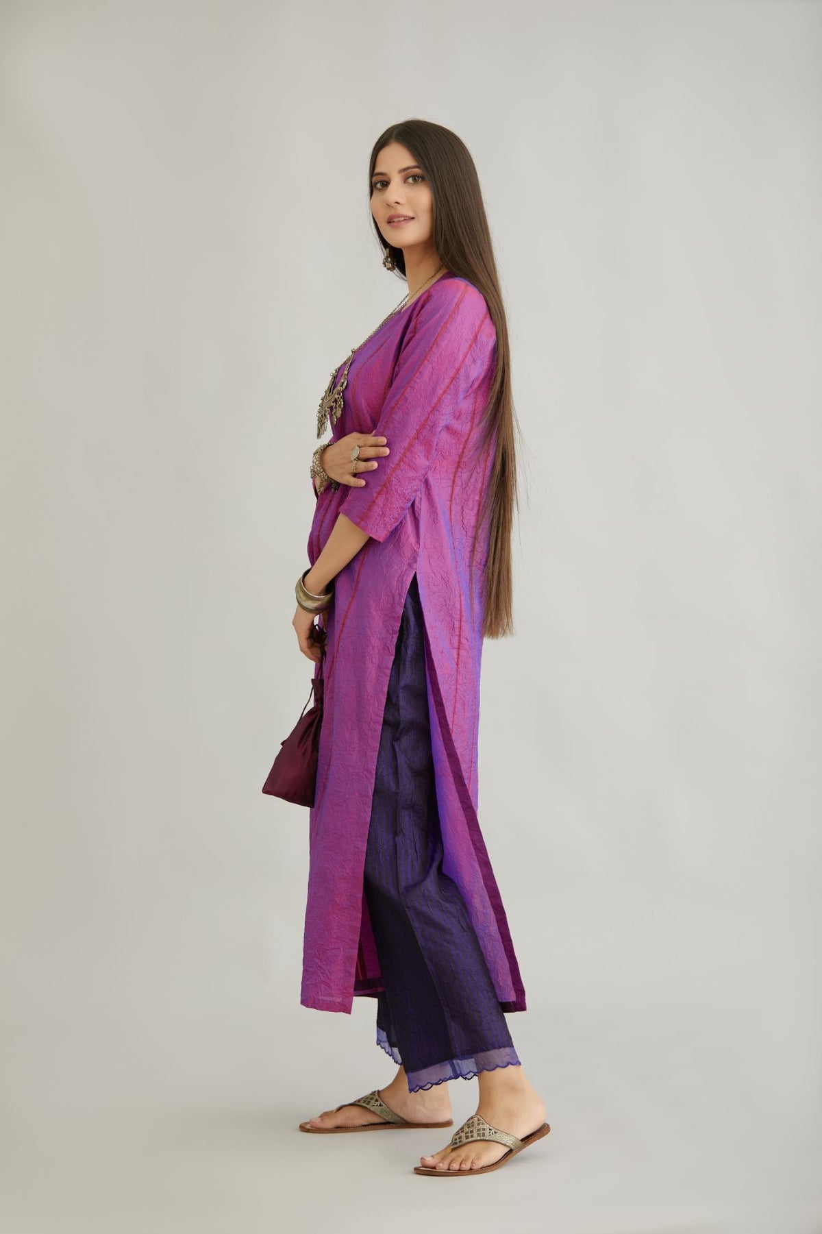 Purple hand crushed silk straight kurta set with vertical organza fabric inset stripe detail in front, back and 3/4 sleeves, highlighted with contrasting top stitch.