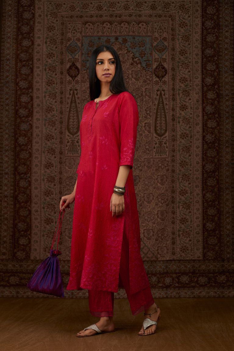 Red hand crushed silk kurta set with all-over contrast silk fabric applique work and embroidered button placket neckline.