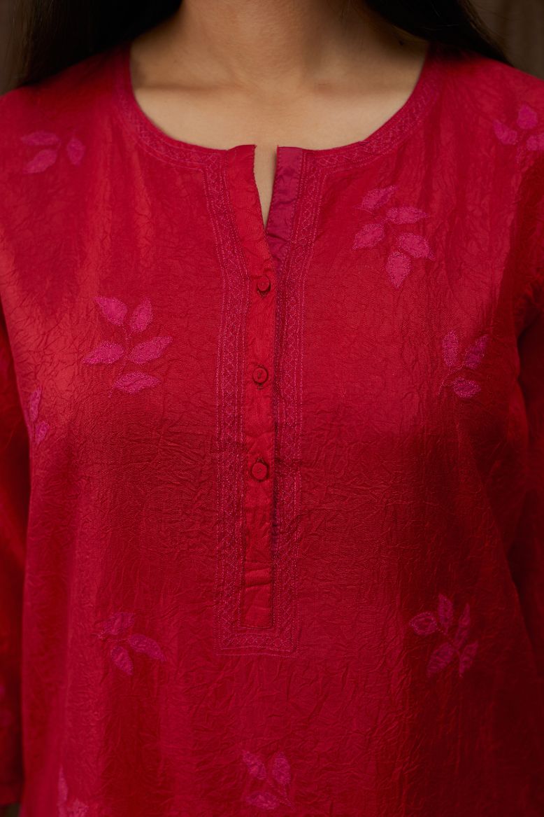 Red hand crushed silk kurta set with all-over contrast silk fabric applique work and embroidered button placket neckline.