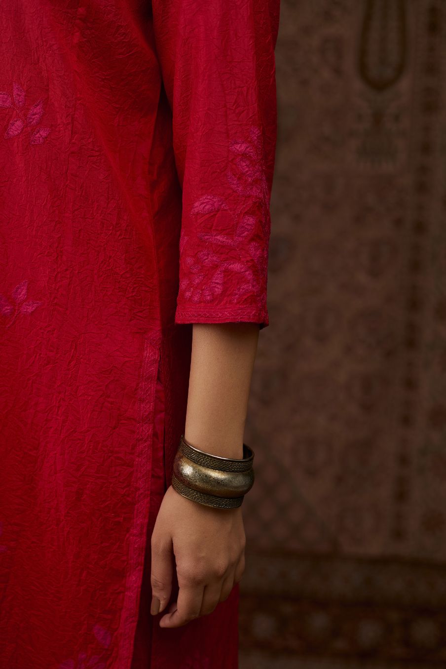 Red hand crushed silk kurta set with all-over contrast silk fabric applique work and embroidered button placket neckline.