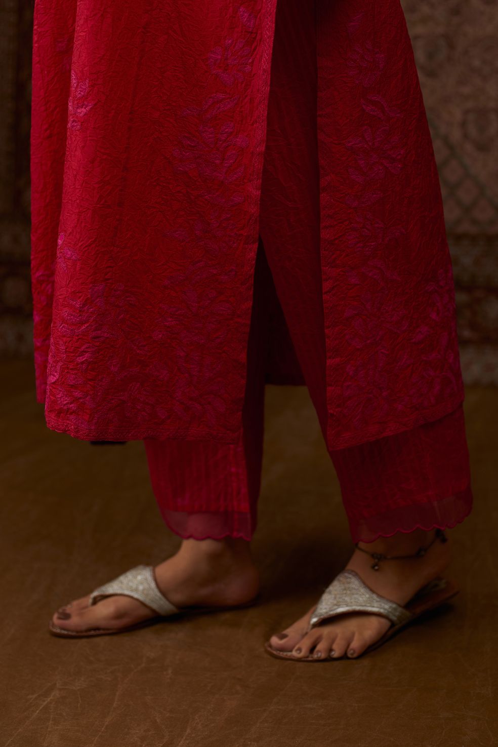Red hand crushed silk kurta set with all-over contrast silk fabric applique work and embroidered button placket neckline.