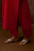 Red hand crushed silk kurta set with all-over contrast silk fabric applique work and embroidered button placket neckline.