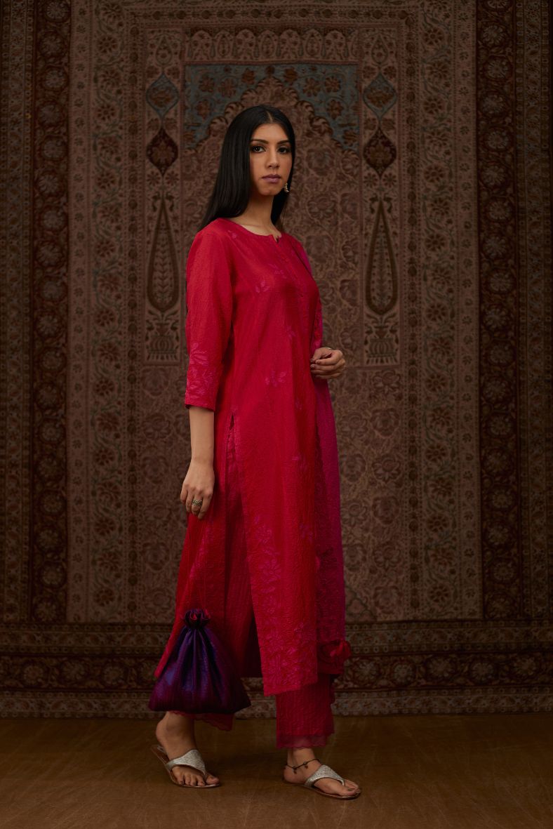 Red hand crushed silk kurta set with all-over contrast silk fabric applique work and embroidered button placket neckline.
