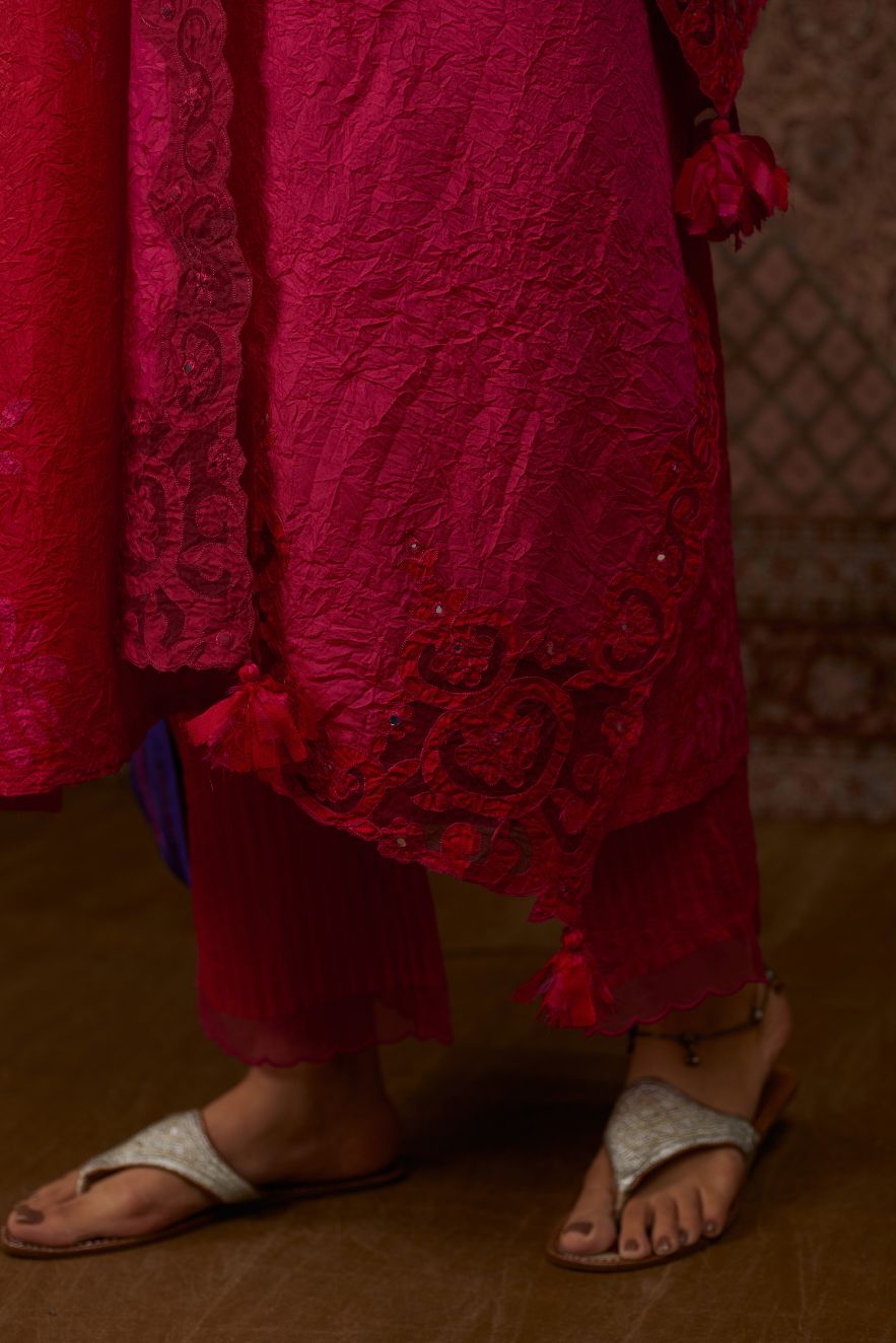 Red hand crushed silk kurta set with all-over contrast silk fabric applique work and embroidered button placket neckline.