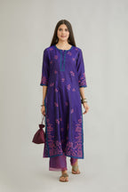 Blue hand crushed silk kurta set with all-over contrast silk fabric applique work and embroidered button placket neckline.