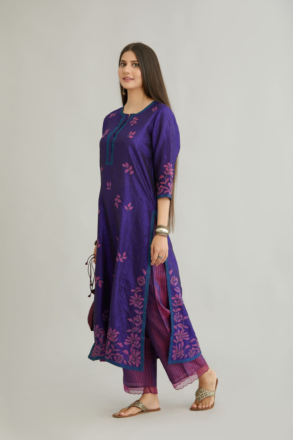 Blue hand crushed silk kurta set with all-over contrast silk fabric applique work and embroidered button placket neckline.