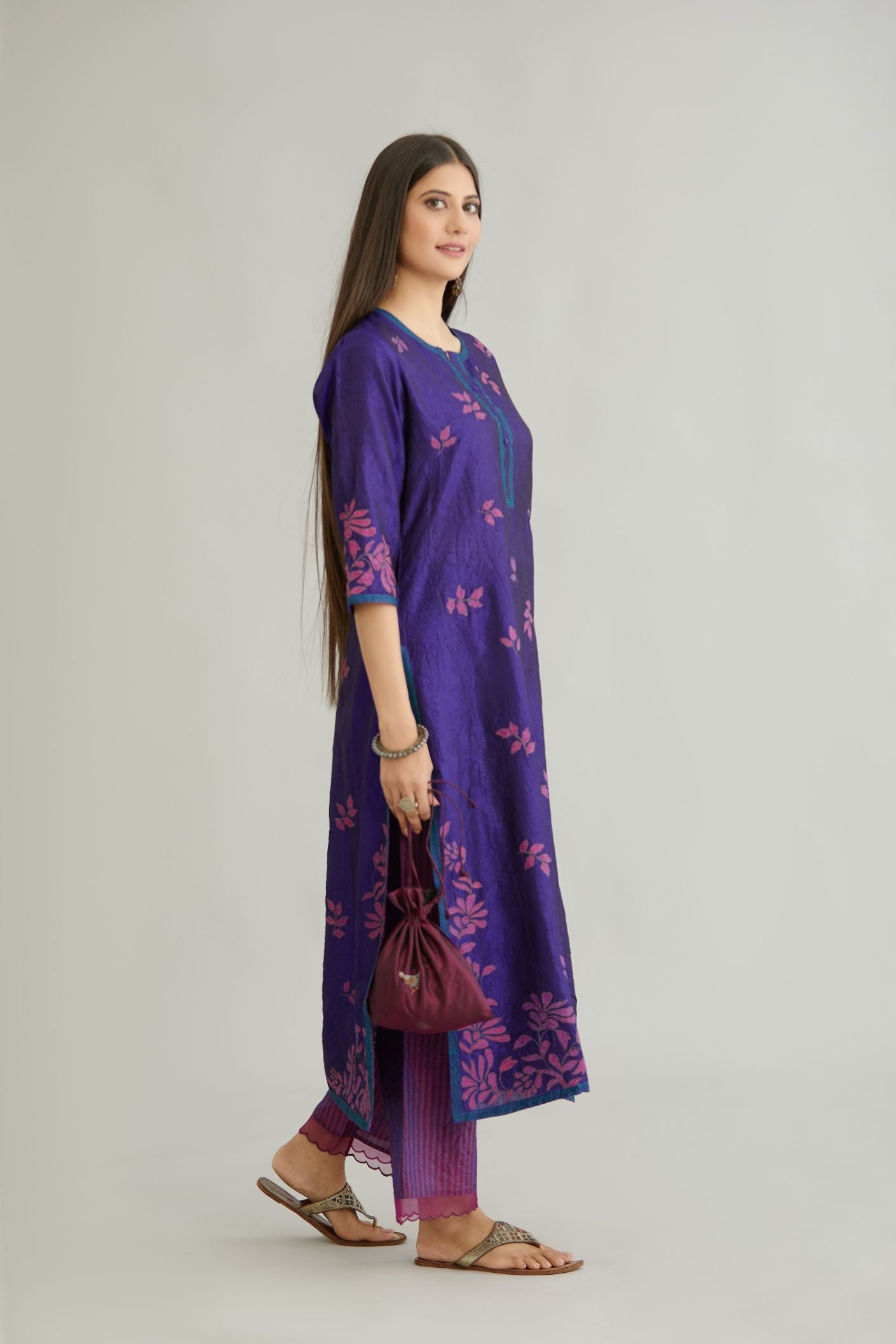 Blue hand crushed silk kurta set with all-over contrast silk fabric applique work and embroidered button placket neckline.