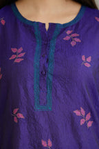 Blue hand crushed silk kurta set with all-over contrast silk fabric applique work and embroidered button placket neckline.