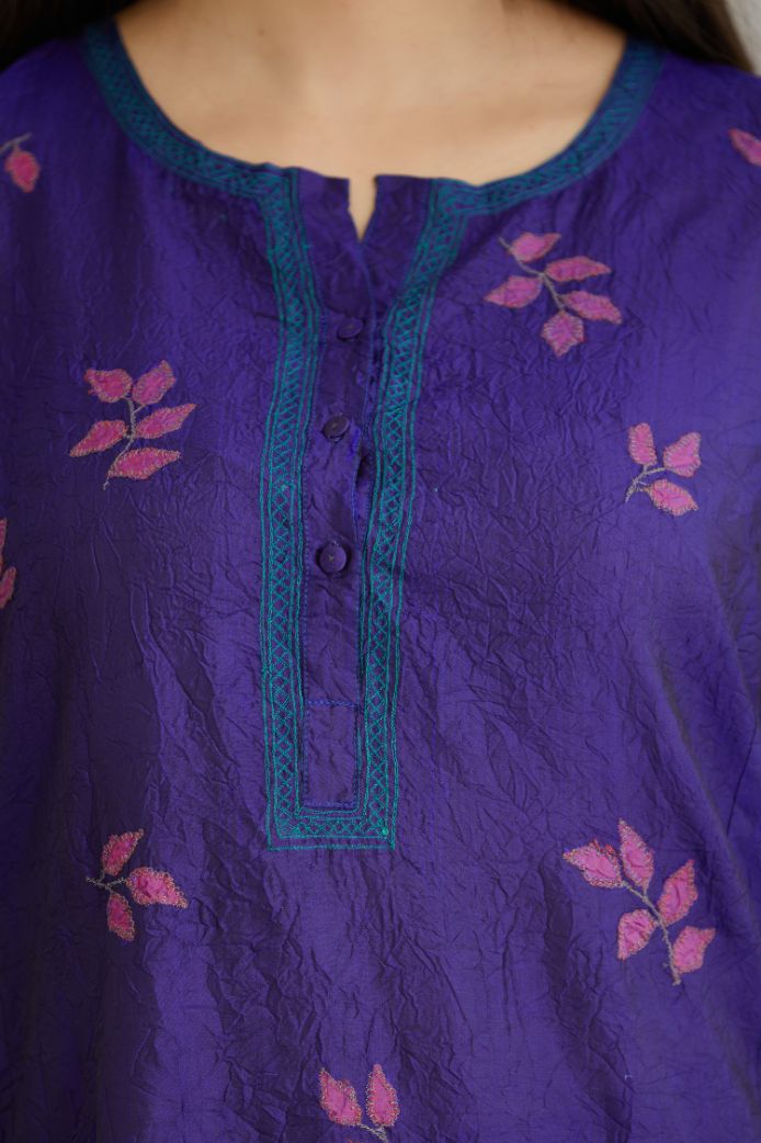 Blue hand crushed silk kurta set with all-over contrast silk fabric applique work and embroidered button placket neckline.