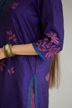 Blue hand crushed silk kurta set with all-over contrast silk fabric applique work and embroidered button placket neckline.