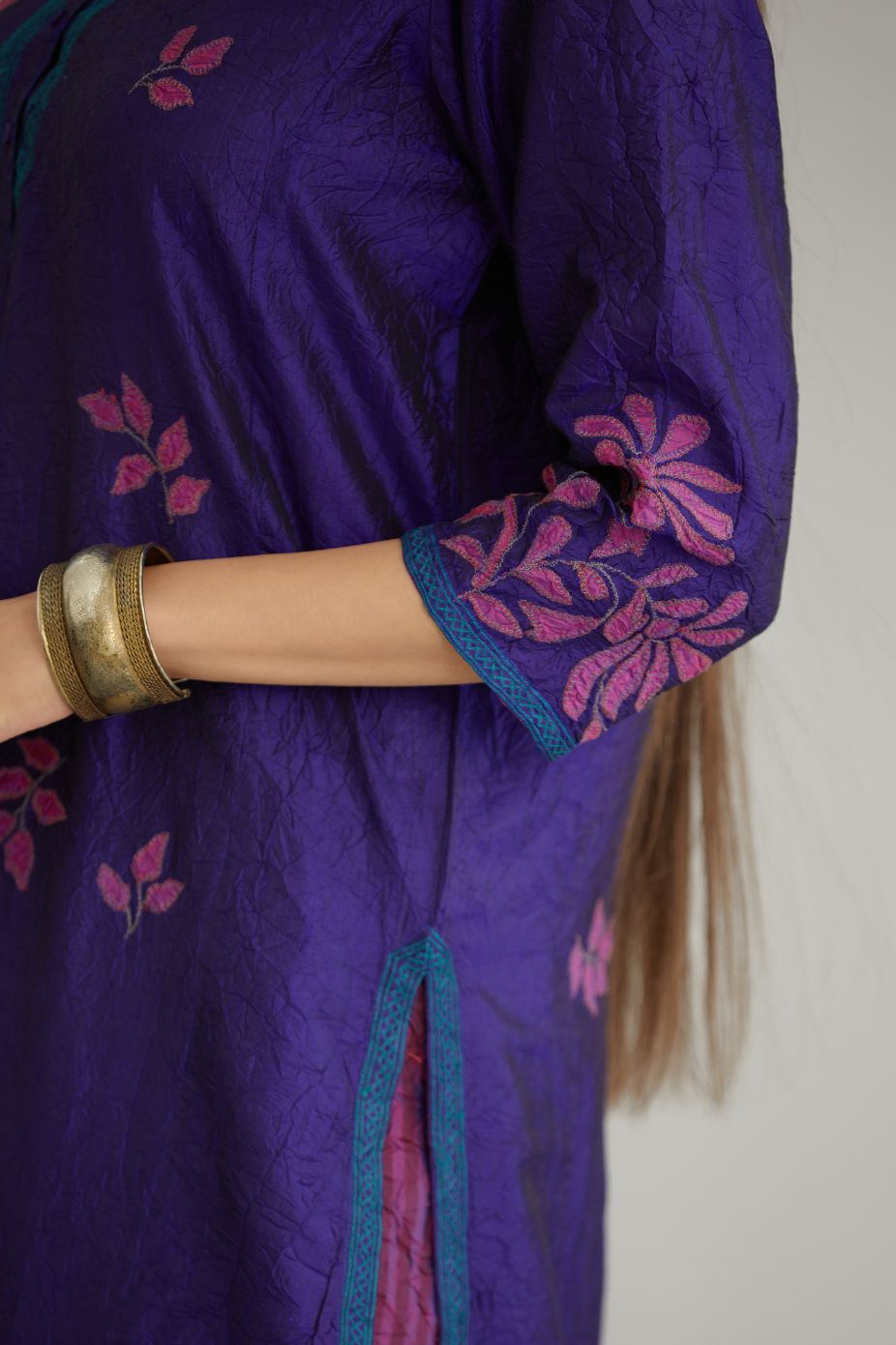 Blue hand crushed silk kurta set with all-over contrast silk fabric applique work and embroidered button placket neckline.