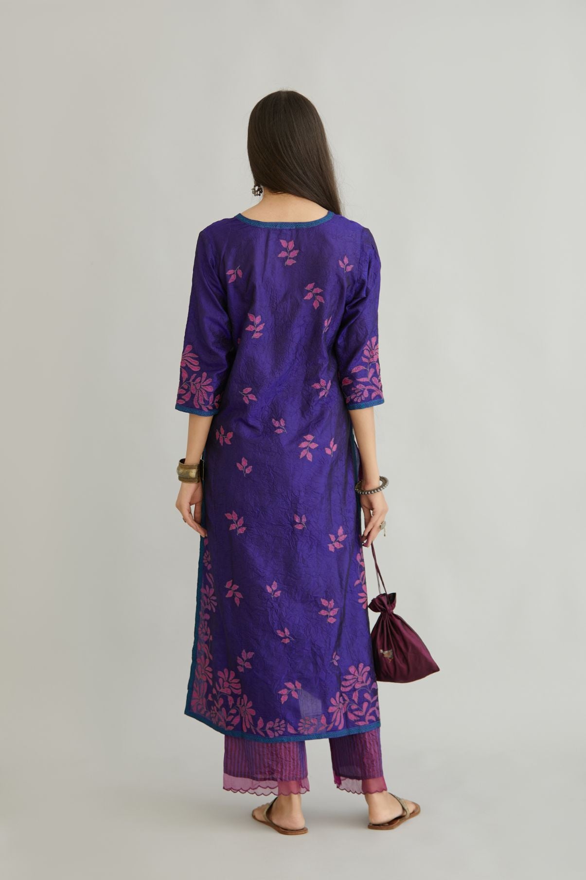 Blue hand crushed silk kurta set with all-over contrast silk fabric applique work and embroidered button placket neckline.
