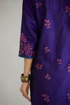 Blue hand crushed silk kurta set with all-over contrast silk fabric applique work and embroidered button placket neckline.