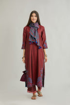 Maroon hand crushed silk kurta set with contrast silk fabric applique work at hem, side slits and sleeves with an embroidered neckline.