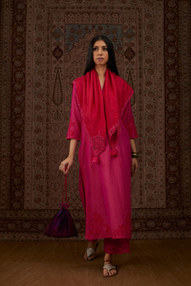 Fuchsia hand crushed silk kurta set with contrast silk fabric applique work at hem, side slits and sleeves with an embroidered neckline.