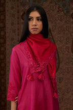 Fuchsia hand crushed silk kurta set with contrast silk fabric applique work at hem, side slits and sleeves with an embroidered neckline.
