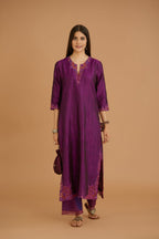 Purple hand crushed silk straight kurta set with silk and organza cutwork embroidery, highlighted with hand attached mirrors.