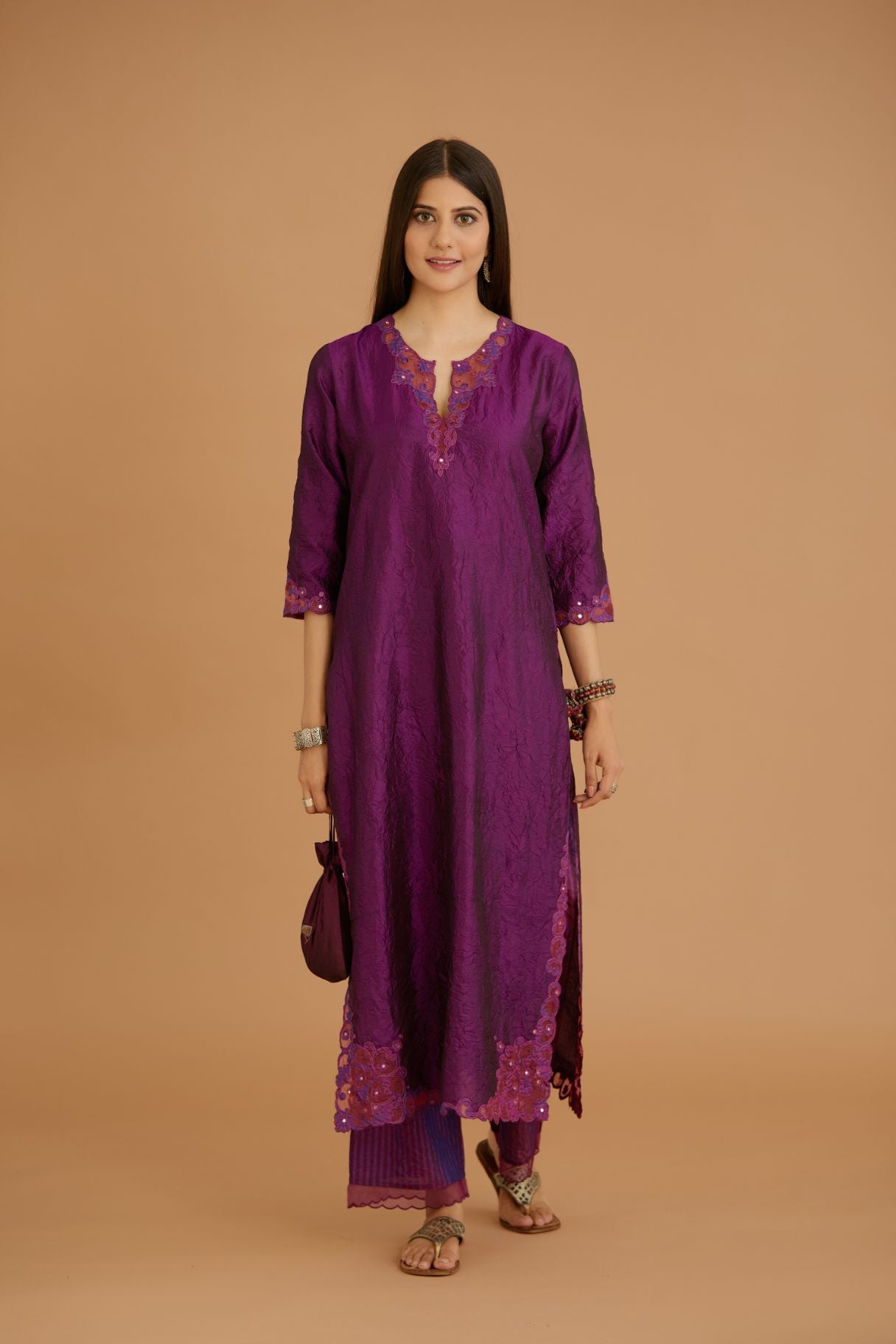 Purple hand crushed silk straight kurta set with silk and organza cutwork embroidery, highlighted with hand attached mirrors.