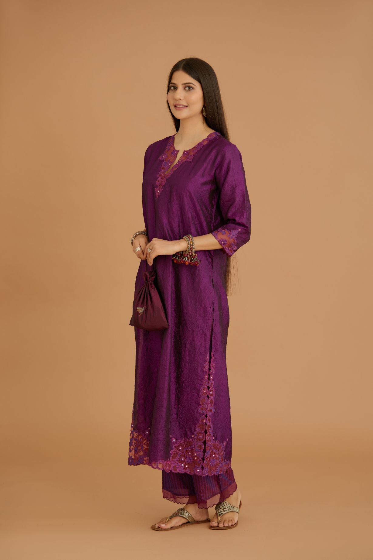 Purple hand crushed silk straight kurta set with silk and organza cutwork embroidery, highlighted with hand attached mirrors.