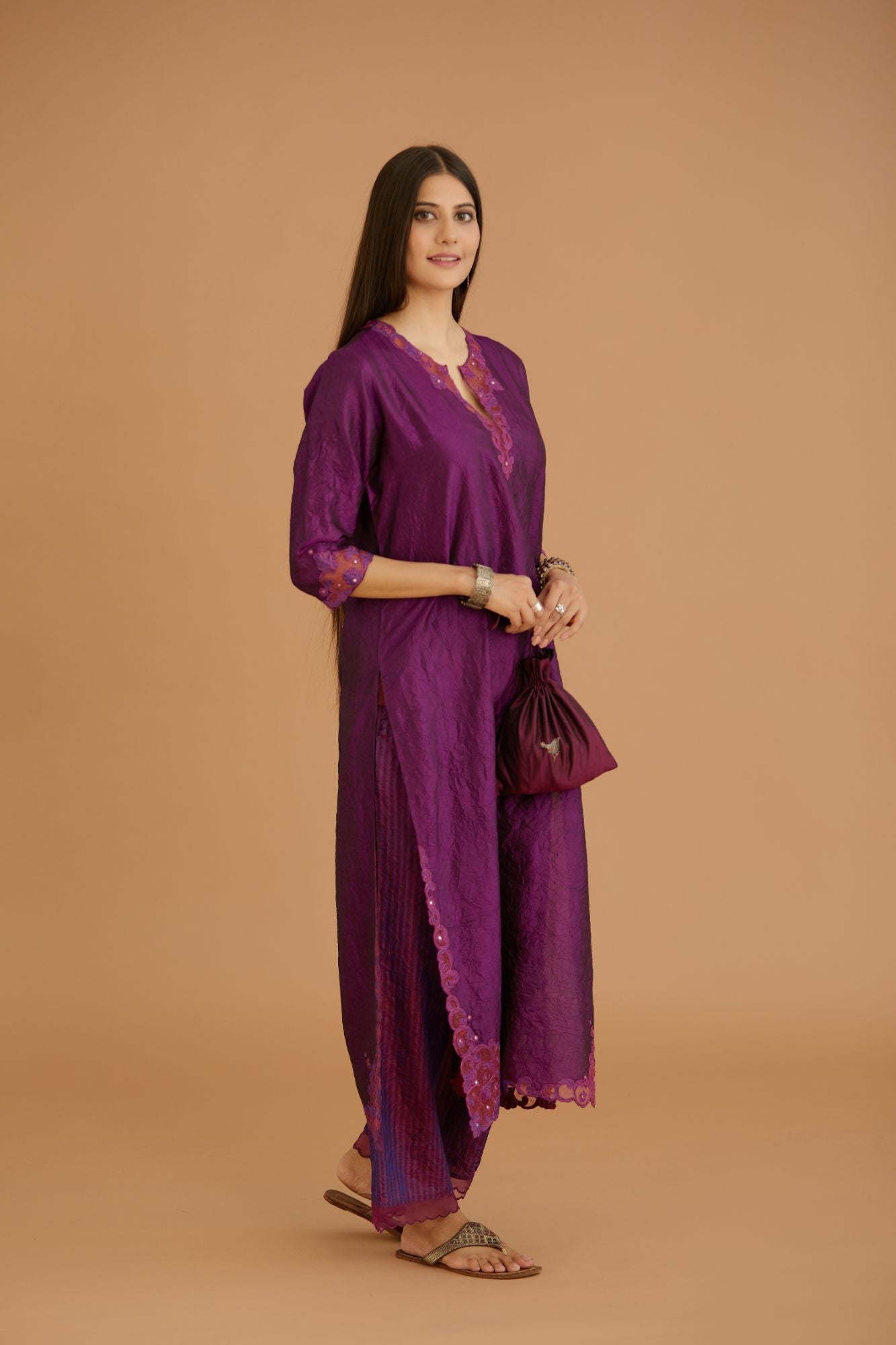 Purple hand crushed silk straight kurta set with silk and organza cutwork embroidery, highlighted with hand attached mirrors.