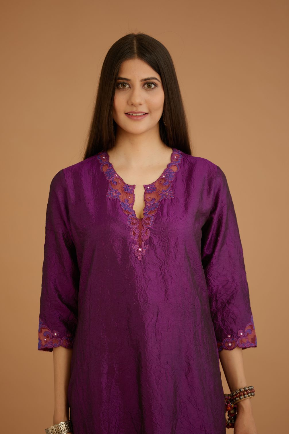 Purple hand crushed silk straight kurta set with silk and organza cutwork embroidery, highlighted with hand attached mirrors.