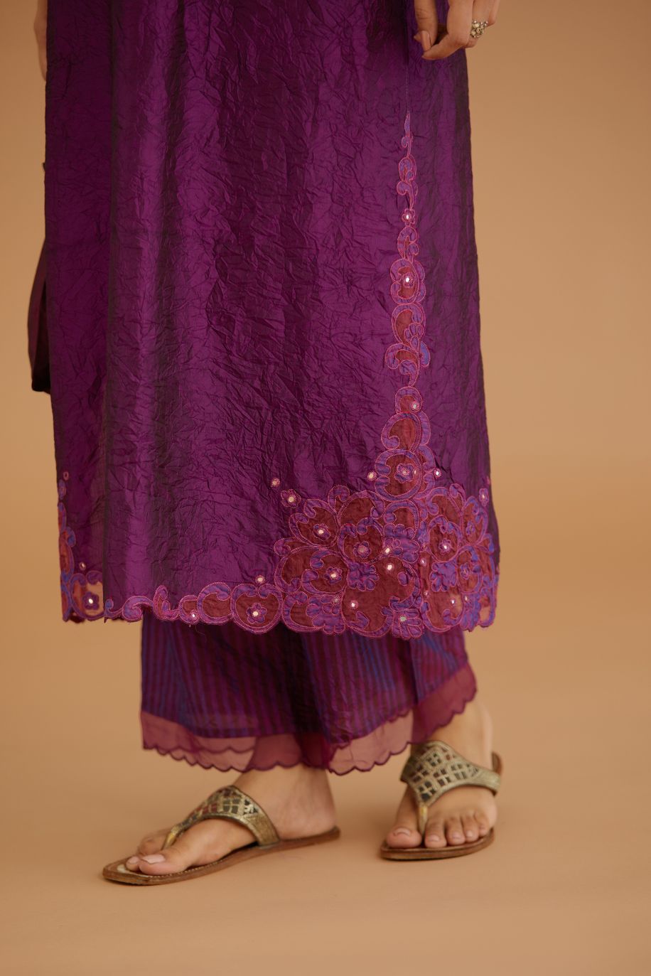 Purple hand crushed silk straight kurta set with silk and organza cutwork embroidery, highlighted with hand attached mirrors.