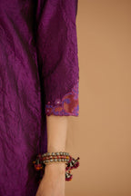 Purple hand crushed silk straight kurta set with silk and organza cutwork embroidery, highlighted with hand attached mirrors.