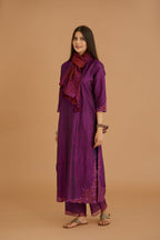 Purple hand crushed silk straight kurta set with silk and organza cutwork embroidery, highlighted with hand attached mirrors.