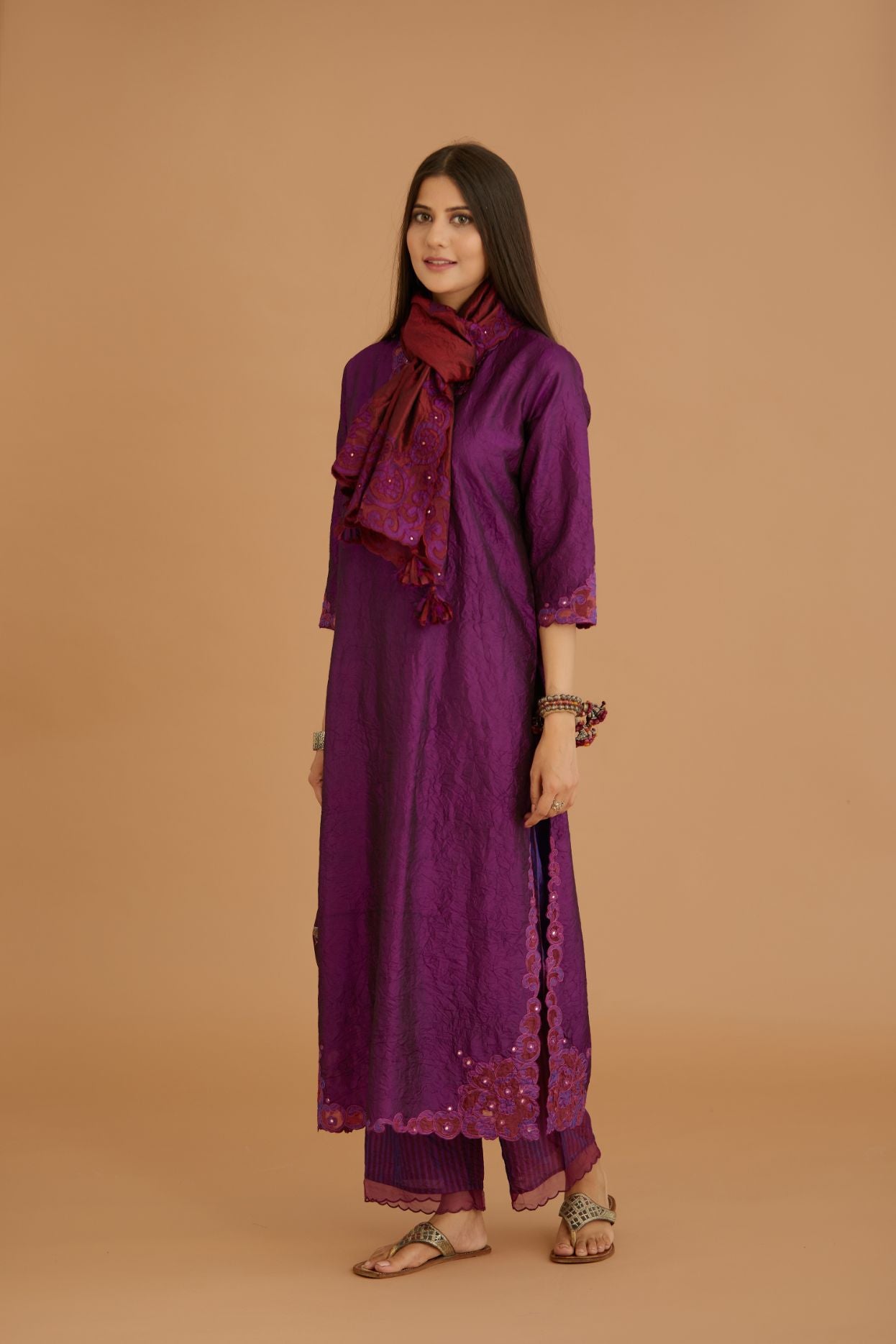 Purple hand crushed silk straight kurta set with silk and organza cutwork embroidery, highlighted with hand attached mirrors.