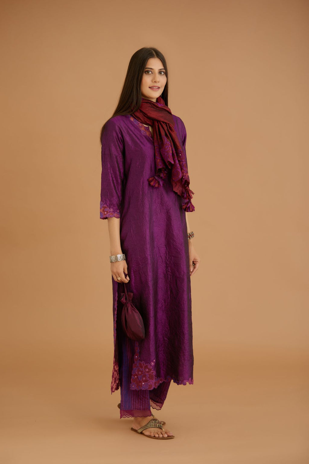 Purple hand crushed silk straight kurta set with silk and organza cutwork embroidery, highlighted with hand attached mirrors.