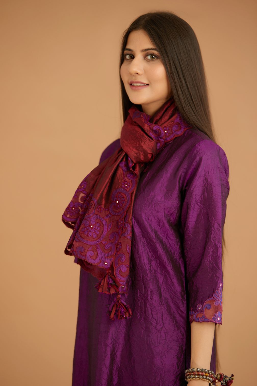 Purple hand crushed silk straight kurta set with silk and organza cutwork embroidery, highlighted with hand attached mirrors.
