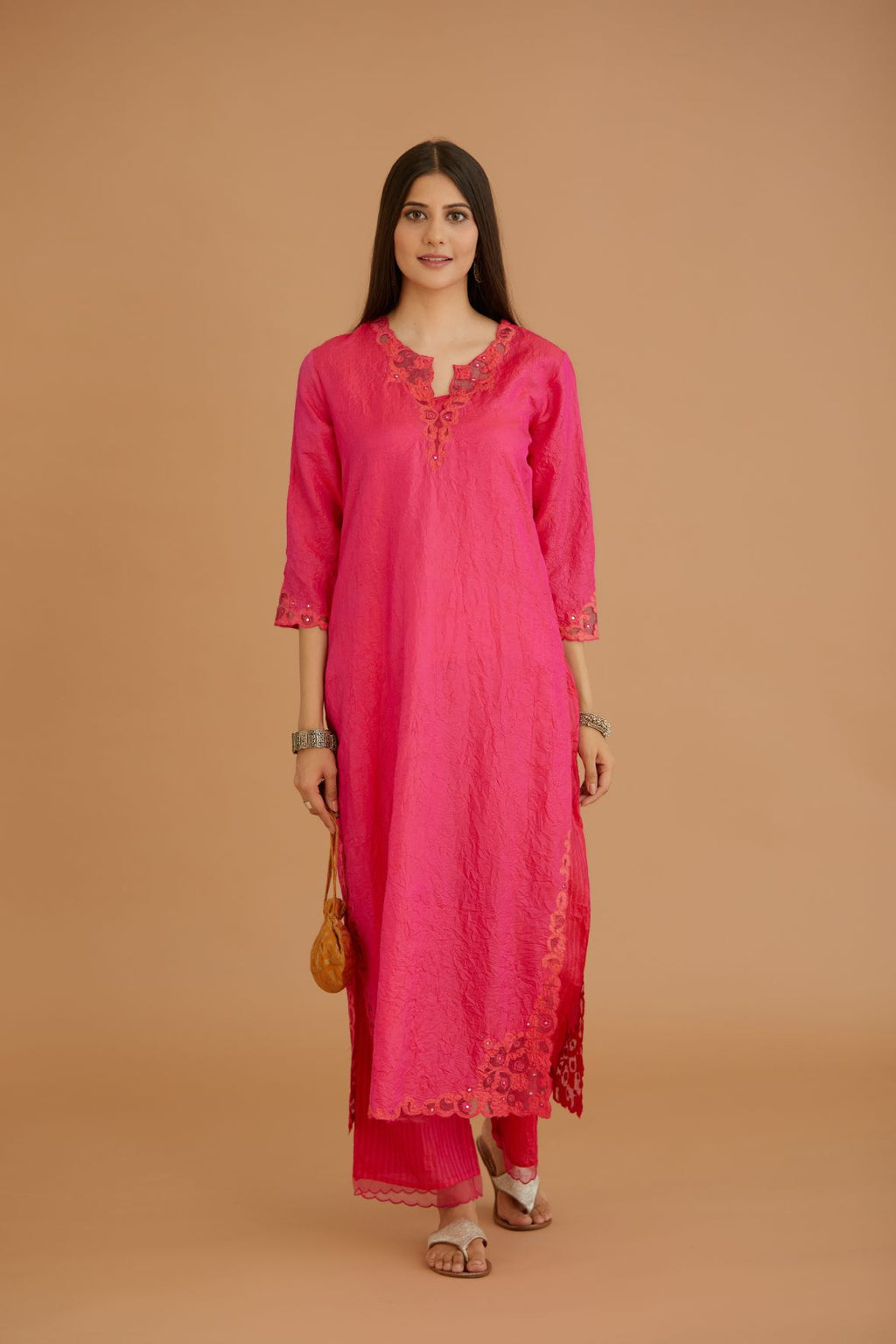 Fuchsia hand crushed silk straight kurta set with silk and organza cutwork embroidery, highlighted with hand attached mirrors.