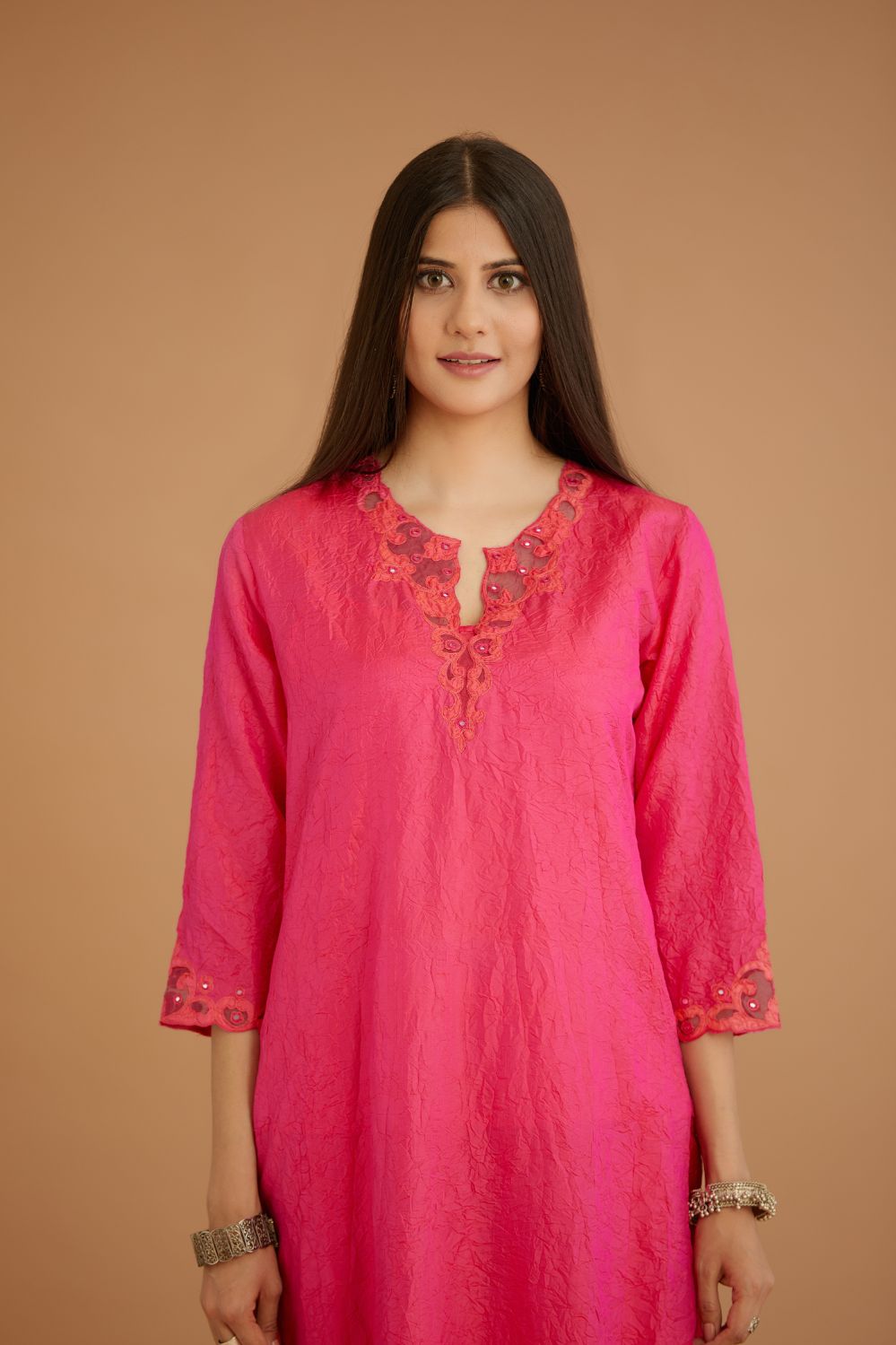 Fuchsia hand crushed silk straight kurta set with silk and organza cutwork embroidery, highlighted with hand attached mirrors.