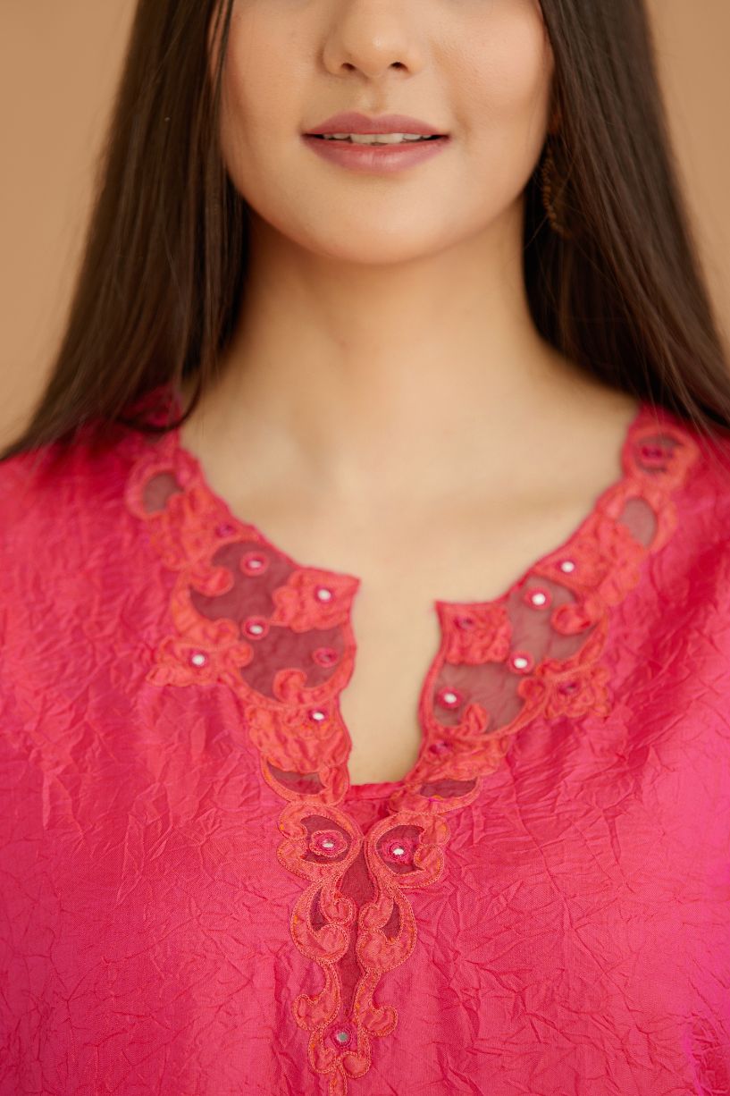 Fuchsia hand crushed silk straight kurta set with silk and organza cutwork embroidery, highlighted with hand attached mirrors.