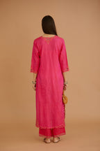 Fuchsia hand crushed silk straight kurta set with silk and organza cutwork embroidery, highlighted with hand attached mirrors.