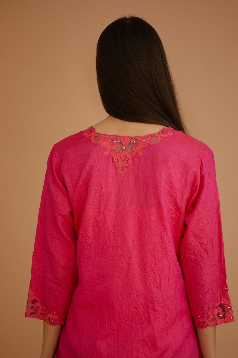 Fuchsia hand crushed silk straight kurta set with silk and organza cutwork embroidery, highlighted with hand attached mirrors.