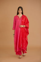 Fuchsia hand crushed silk straight kurta set with silk and organza cutwork embroidery, highlighted with hand attached mirrors.