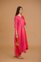 Fuchsia hand crushed silk straight kurta set with silk and organza cutwork embroidery, highlighted with hand attached mirrors.