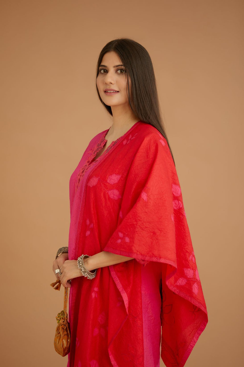 Fuchsia hand crushed silk straight kurta set with silk and organza cutwork embroidery, highlighted with hand attached mirrors.