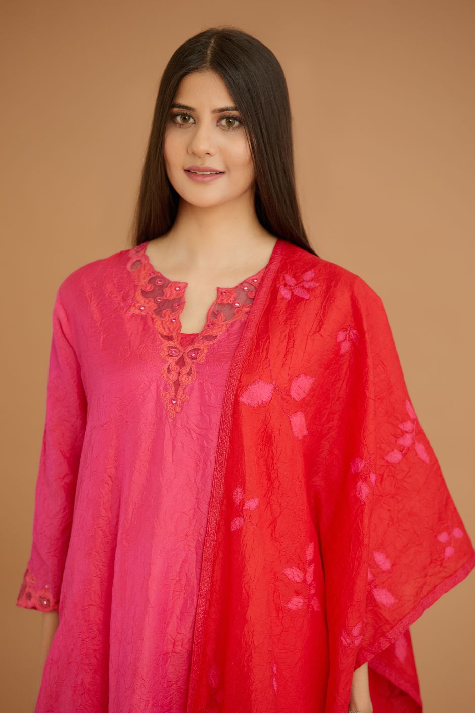 Fuchsia hand crushed silk straight kurta set with silk and organza cutwork embroidery, highlighted with hand attached mirrors.