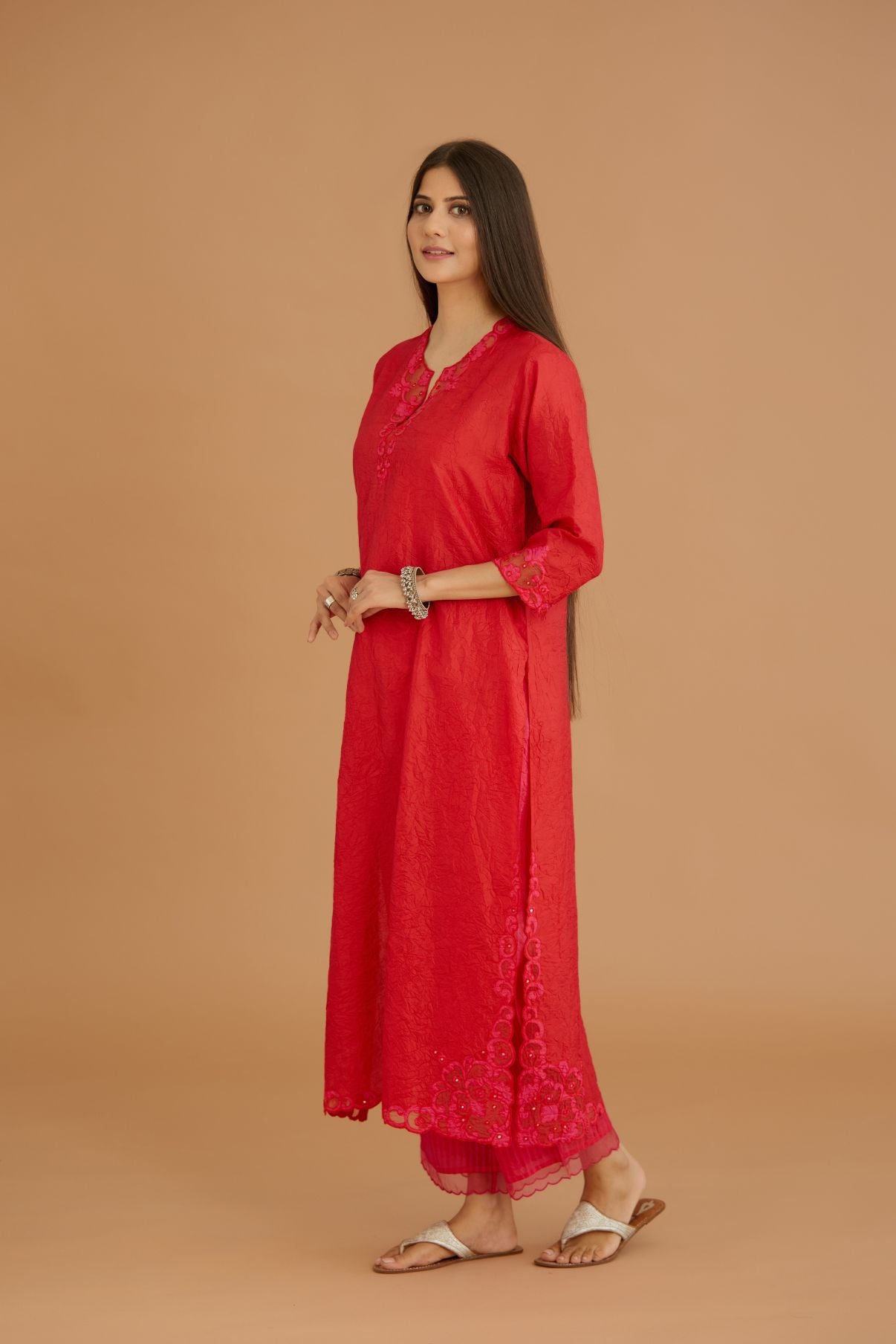 Red hand crushed silk straight kurta set with silk and organza cutwork embroidery, highlighted with hand attached mirrors.