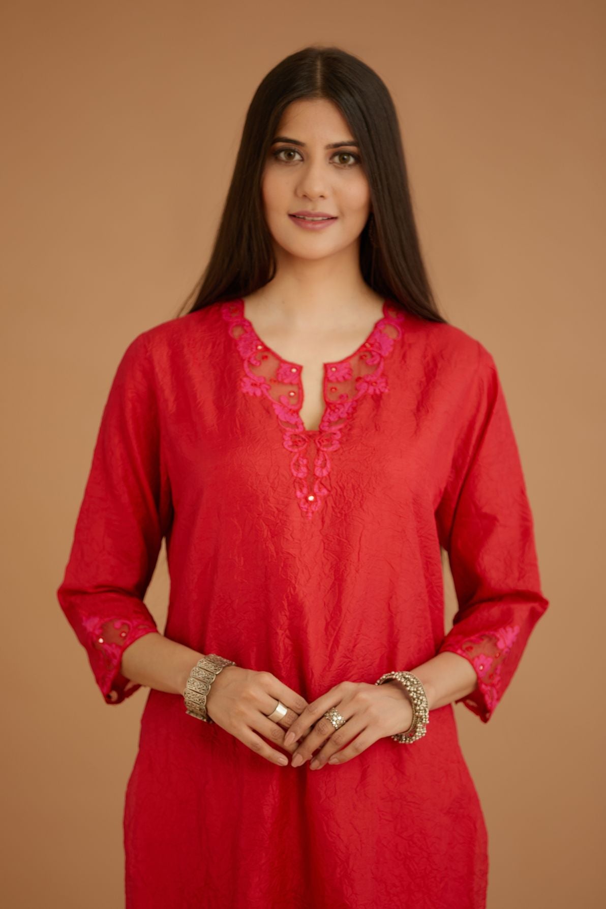 Red hand crushed silk straight kurta set with silk and organza cutwork embroidery, highlighted with hand attached mirrors.