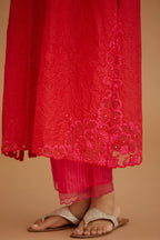 Red hand crushed silk straight kurta set with silk and organza cutwork embroidery, highlighted with hand attached mirrors.