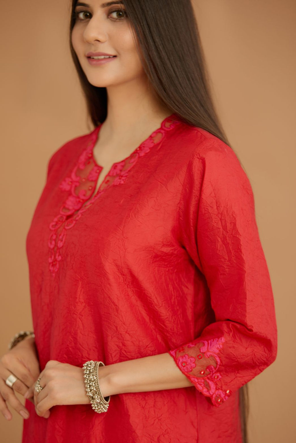 Red hand crushed silk straight kurta set with silk and organza cutwork embroidery, highlighted with hand attached mirrors.