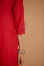 Red hand crushed silk straight kurta set with silk and organza cutwork embroidery, highlighted with hand attached mirrors.